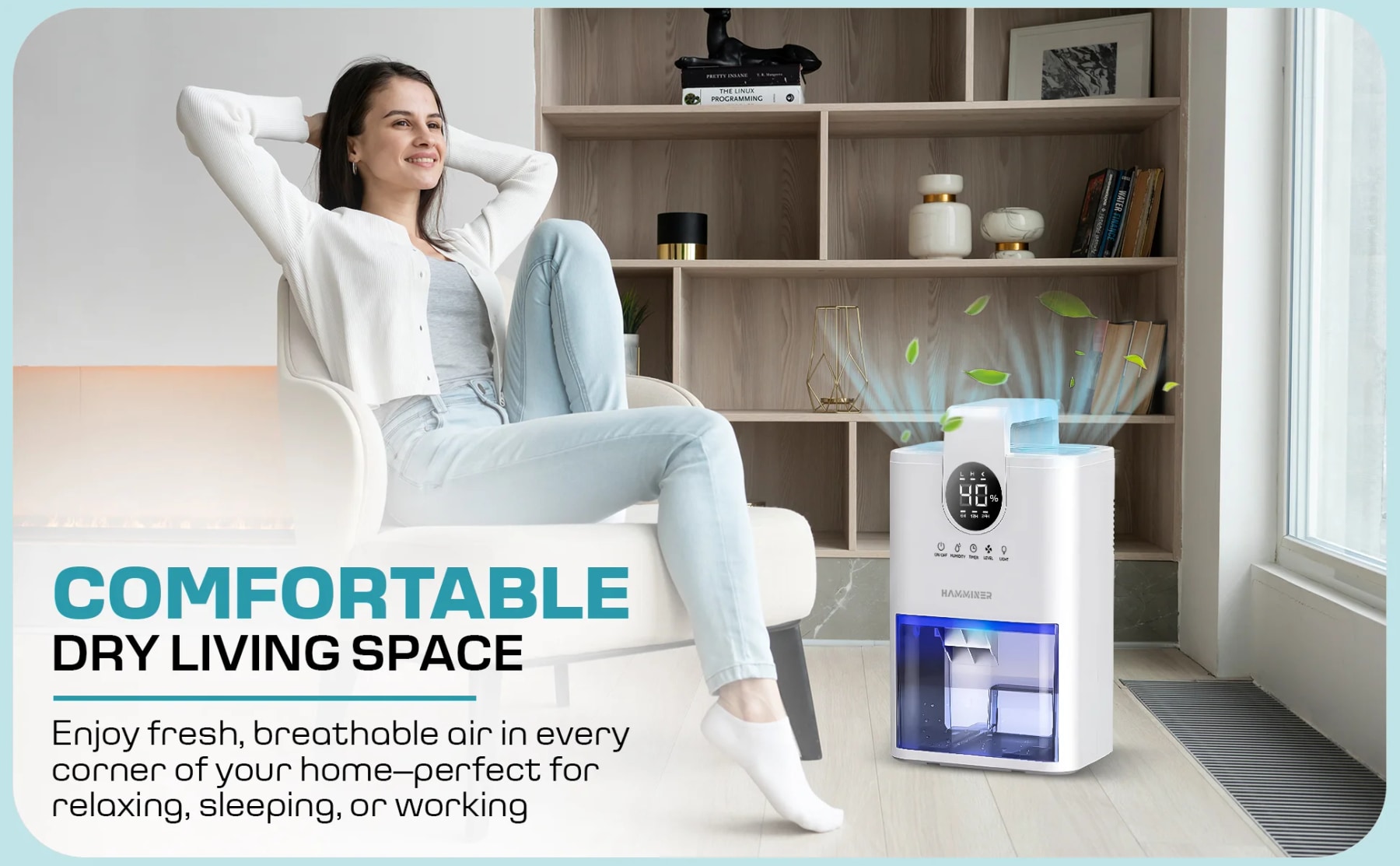 Woman relaxing in an armchair beside a white Hamminer dehumidifier with a blue-lit water tank.