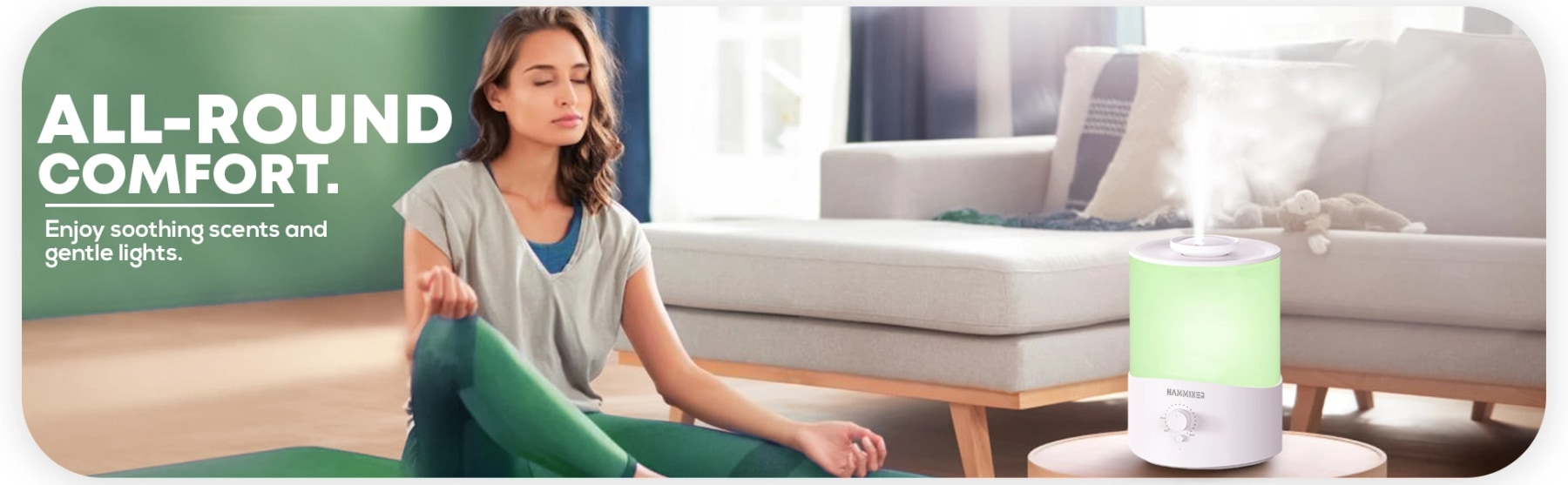 Woman meditating beside a HAMMINER humidifier releasing mist with soft green lighting.